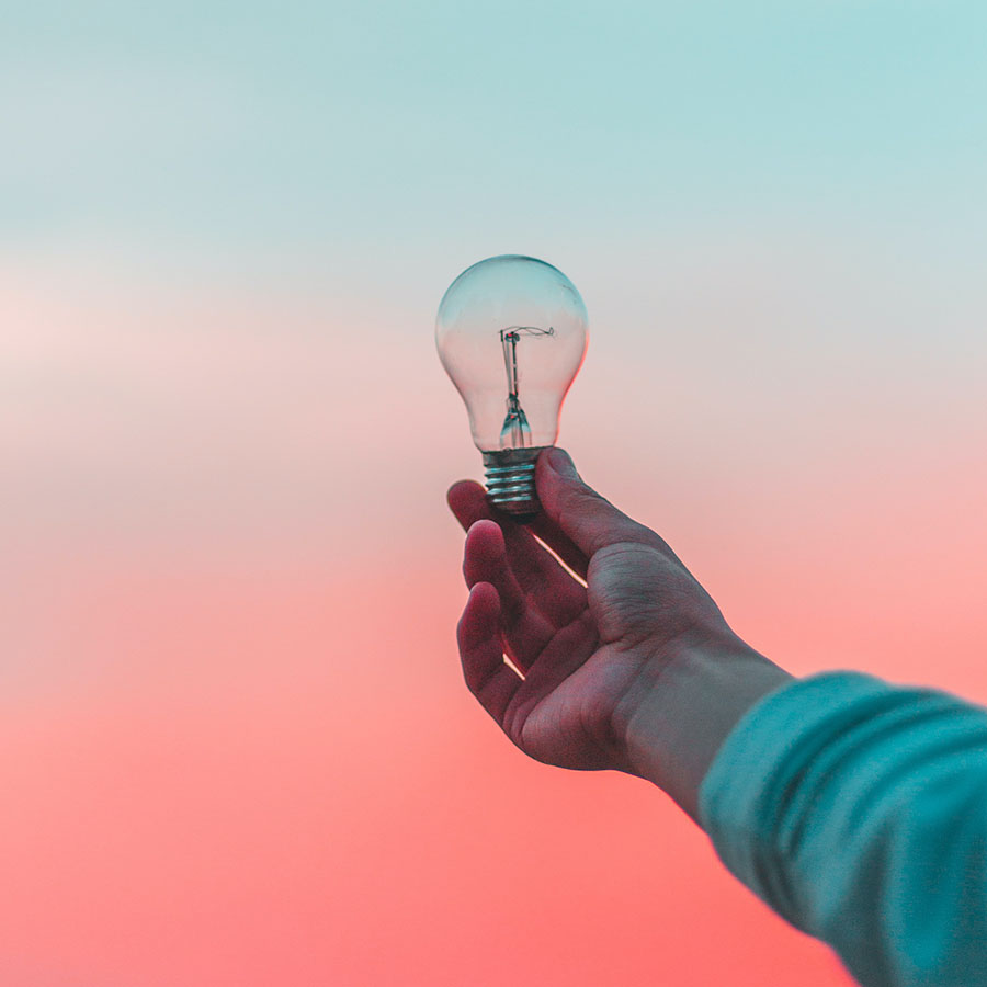 Lightbulb against a sunrise backdrop